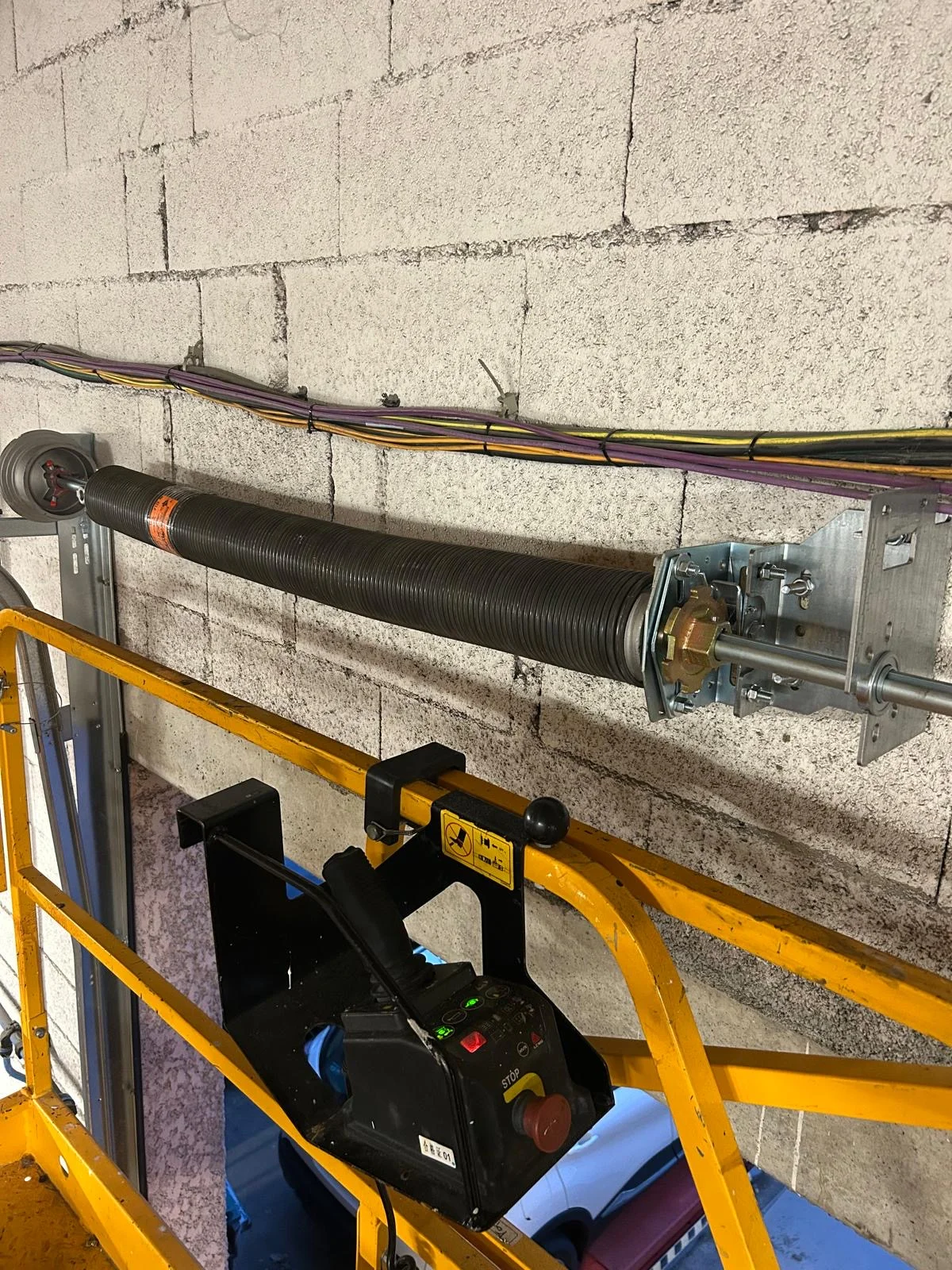 Ressort de torsion d'une porte sectionnelle